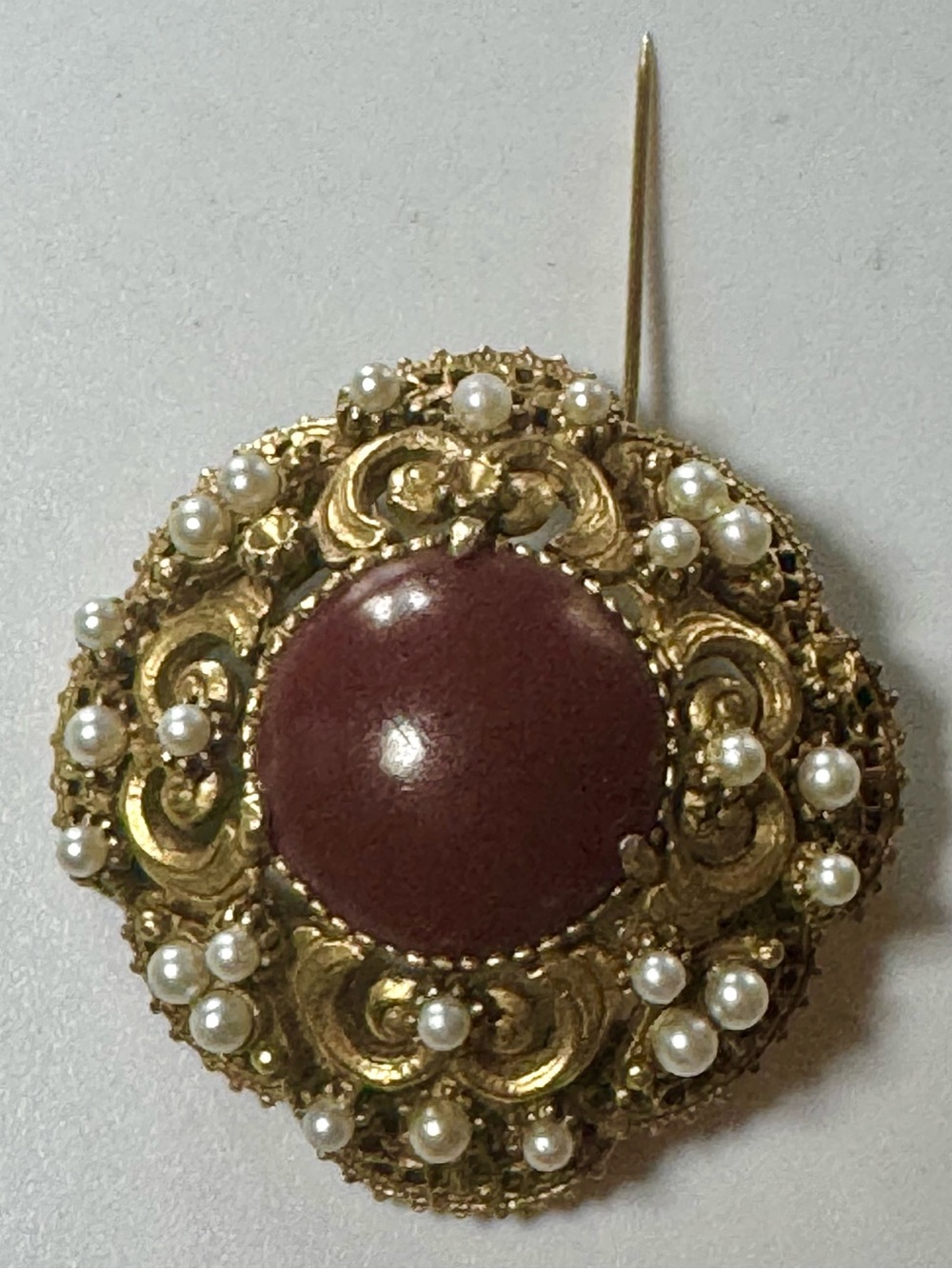 Gold-Tone Brooch with Maroon Center and Pearl Accents